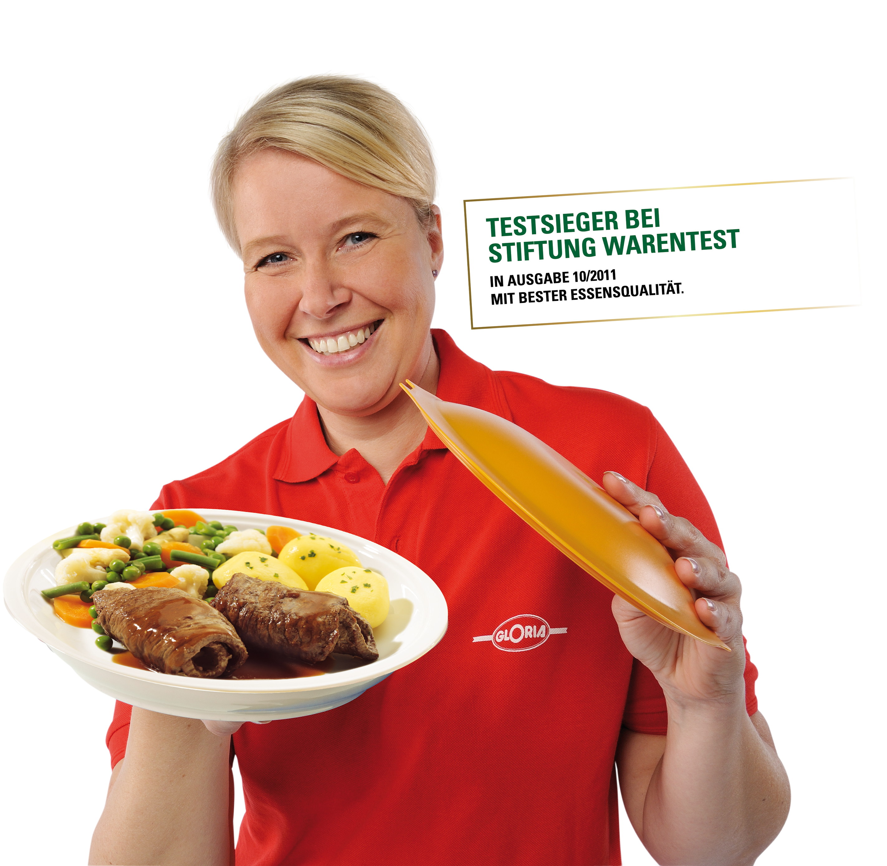 Testsieger bei Stiftung Warentest 10/2011 – Gloria überzeugt mit bester Essensqualität. Mitarbeiterin von Gloria präsentiert ein Gericht mit Rouladen, Kartoffeln und Gemüse – ausgezeichnet als Testsieger bei Stiftung Warentest 10/2011.